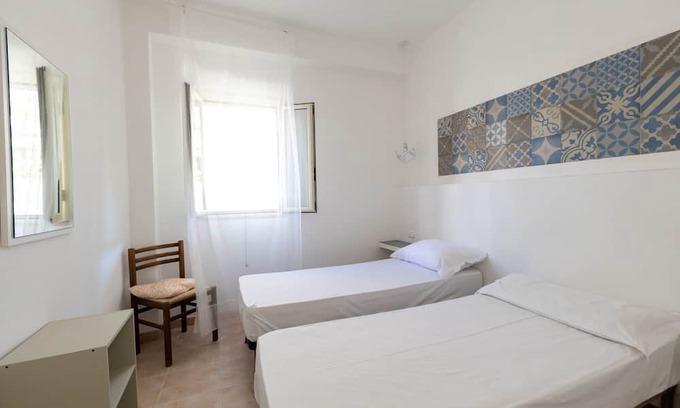 Peschici Apartment | Apartment 'Francesca, Trilo C' with Shared Terrace, Wi-Fi and Air Conditioning
