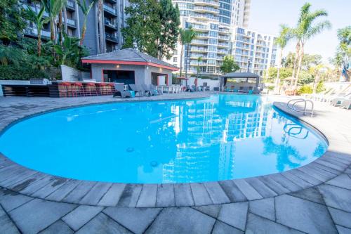 Civic Core Apartment | Downtown Oasis with Pool and Jacuzzi - 4-Star Retreat