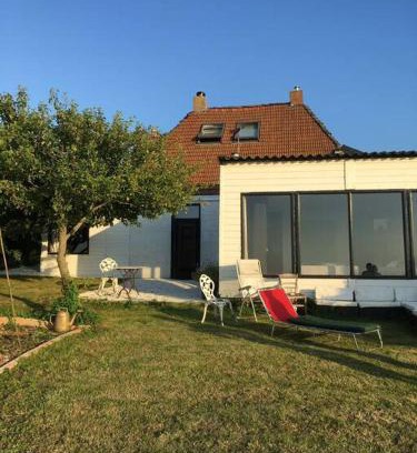 Sint Jacobiparochie Villa | Unique Dijkhuis with Elegant Interior for Family Getaways